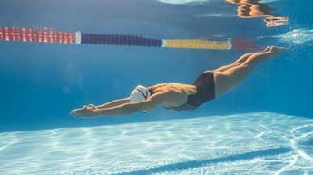 What is good quality swimwear made from and how does it improve performance in the water?
